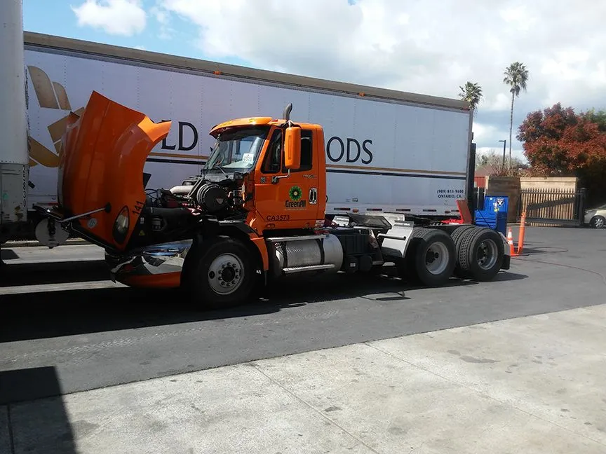 Orange semi-truck in the bay